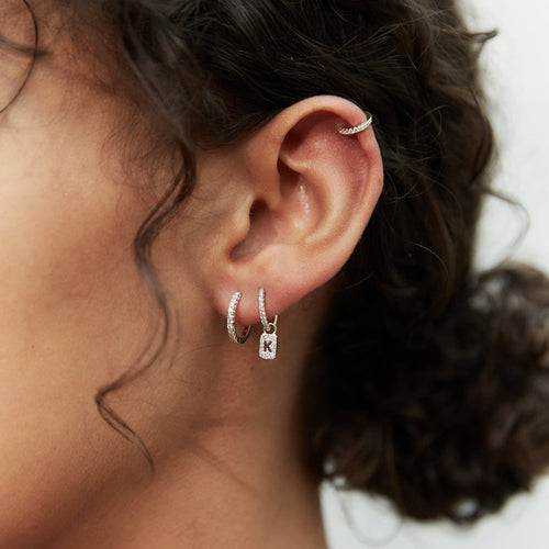 Model wearing Large Solid White Gold Diamond Huggie Hoops